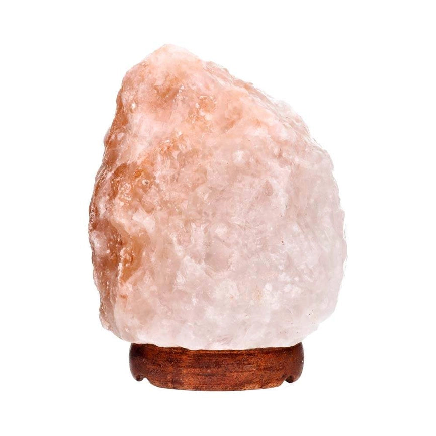 En smuk, håndskåret pink Himalaya saltlampe, der spreder en varm, rolig og naturlig glød i dit hjem.