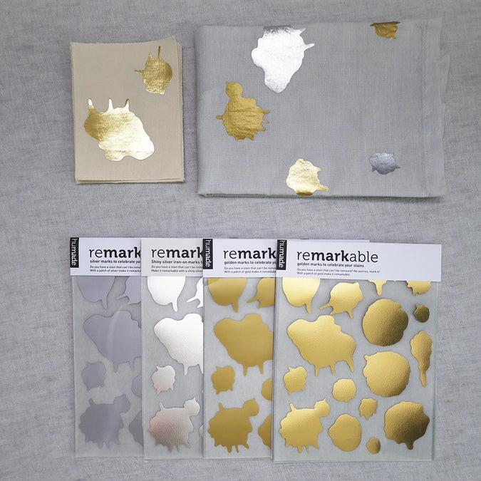 Forvandl pletter og slid til smukke detaljer med ReMarkable strygemærker fra Humade. Kreativ visible mending i mat & blank guld og sølv – reparér tøj med stil.