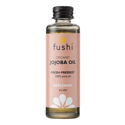Økologisk jojoba olie fra Fushi i brunt glasflaske med dråbetænger til hud og hårpleje