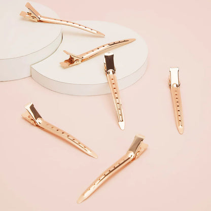 KITSCH Rose Gold Styling Clips – lette, elegante hårklemmer i rosa guld. Sikkert greb til styling, klipning og makeup. 6 stk. i professionel kvalitet.