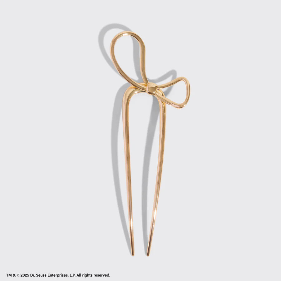 Elegant hårnål i metal fra KITSCH x The Grinch. Festligt sløjfedesign, let og holdbar – perfekt til elegante opsætninger og julelooks. Limited edition.