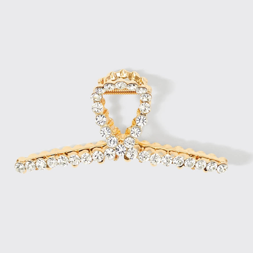 KITSCH guld hårklemme med rhinestones – et luksuriøst håraccessory med stærkt greb og funklende detaljer. Perfekt til både hverdag og festlige opsætninger.