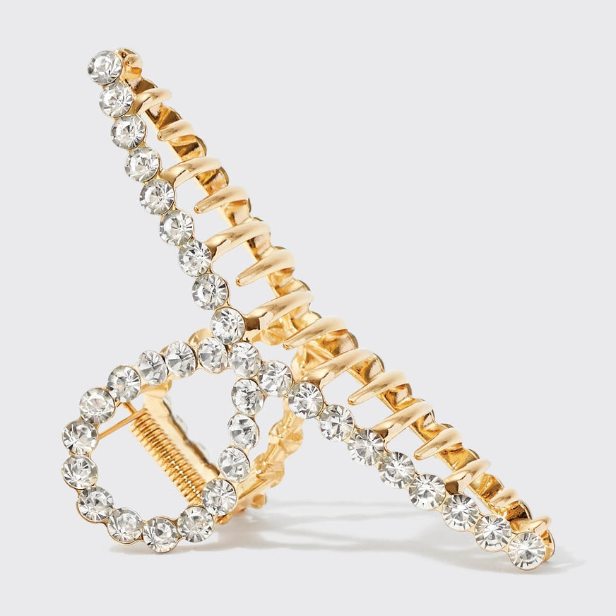 KITSCH guld hårklemme med rhinestones – et luksuriøst håraccessory med stærkt greb og funklende detaljer. Perfekt til både hverdag og festlige opsætninger.