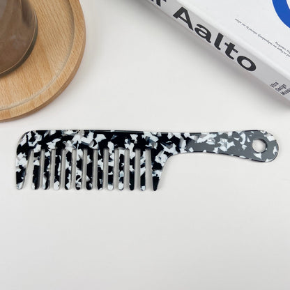 Anti-statisk detangling kam i bæredygtig bioplast. Fremstillet af eukalyptus-acetat – reducerer statisk hår og beskytter håret naturligt.