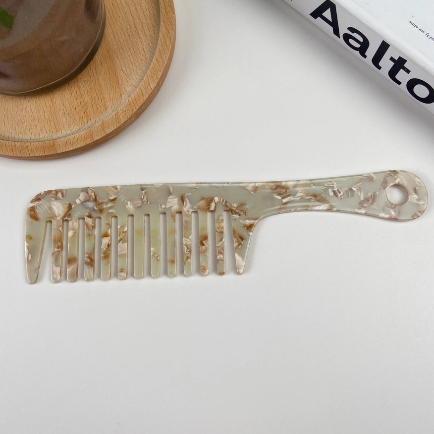 Anti-statisk detangling kam i bæredygtig bioplast. Fremstillet af eukalyptus-acetat – reducerer statisk hår og beskytter håret naturligt.