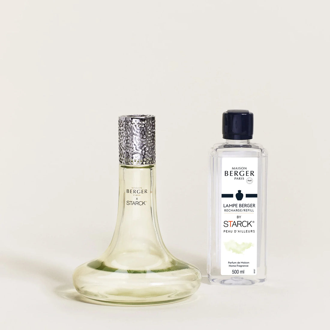 Maison Berger Paris x Philippe Starck Peau d’Ailleurs duftlampe – et ikonisk katalytisk duftlampe-sæt, hvor avantgardistisk design, effektiv luftrensning og en mystisk, mineralsk duft skaber en sanselig rejse ud over det velkendte