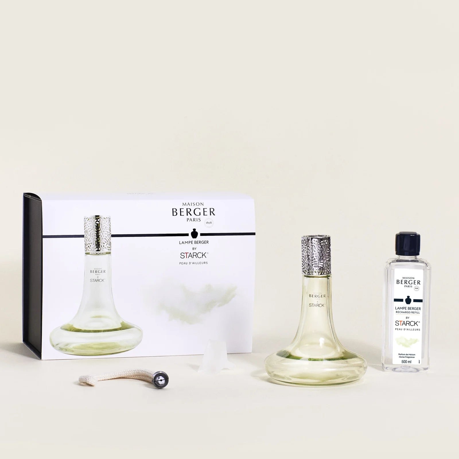 Maison Berger Paris x Philippe Starck Peau d’Ailleurs duftlampe – et ikonisk katalytisk duftlampe-sæt, hvor avantgardistisk design, effektiv luftrensning og en mystisk, mineralsk duft skaber en sanselig rejse ud over det velkendte