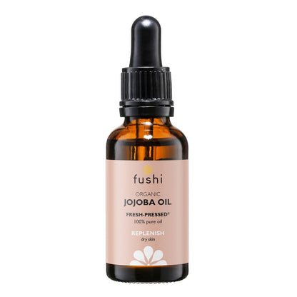 Økologisk jojoba olie fra Fushi i brunt glasflaske med dråbetænger til hud og hårpleje